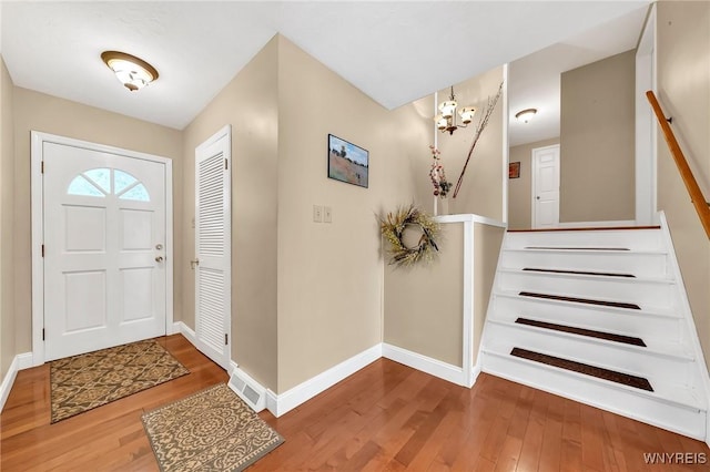 8918 Hurlburt Ln, Clarence, NY 14031 - entrance foyer featuring hardwood / wood-style floors and baseboards