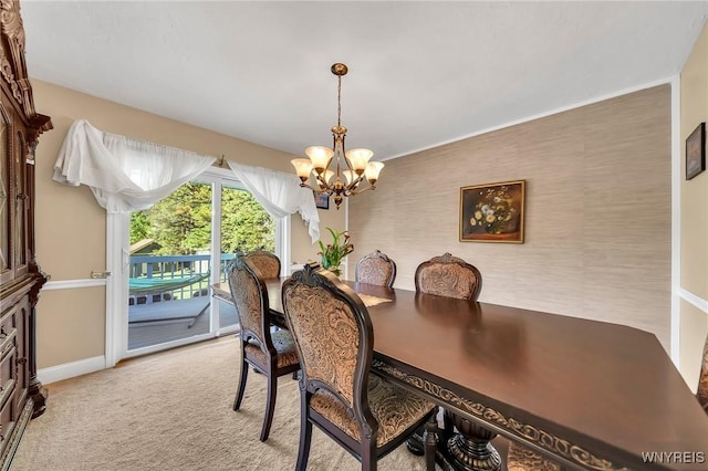 8918 Hurlburt Ln, Clarence, NY 14031 - dining space with a chandelier, baseboards, and light colored carpet