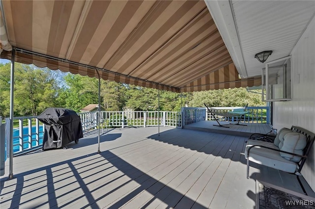 8918 Hurlburt Ln, Clarence, NY 14031 - wooden deck featuring area for grilling, a swimming pool, and view of scattered trees