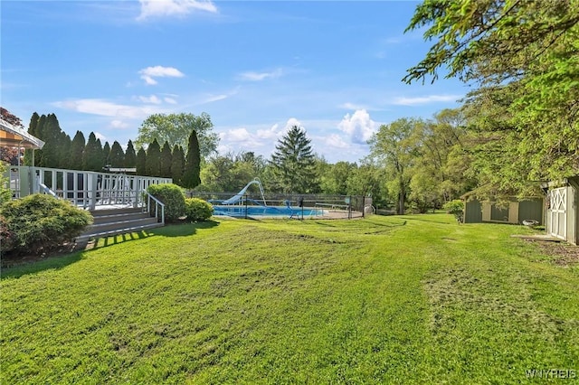 8918 Hurlburt Ln, Clarence, NY 14031 - view of green lawn with a deck