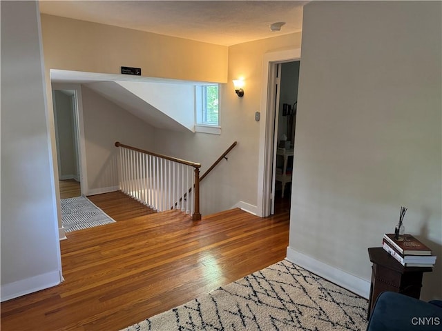 22 Hamilton St, Hamilton, NY 13346 - stairway featuring wood finished floors and baseboards