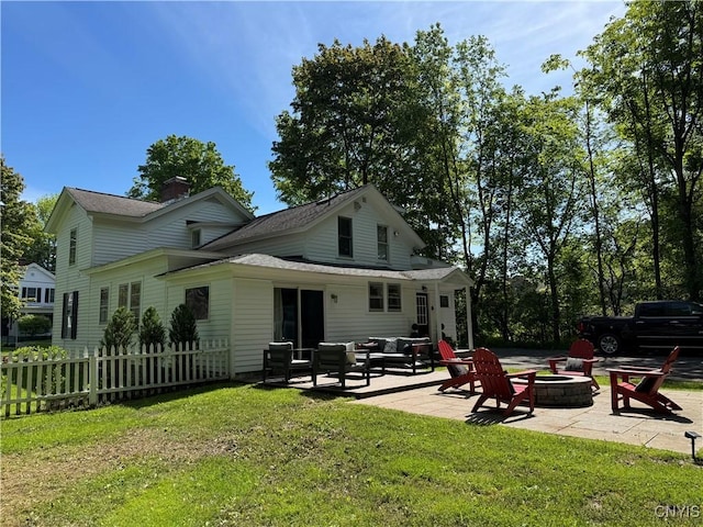 22 Hamilton St, Hamilton, NY 13346 - rear view of house featuring an outdoor living space with a fire pit, a patio, a chimney, and a shingled roof