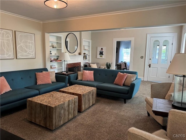22 Hamilton St, Hamilton, NY 13346 - living area with crown molding, carpet, a fireplace, and built in shelves