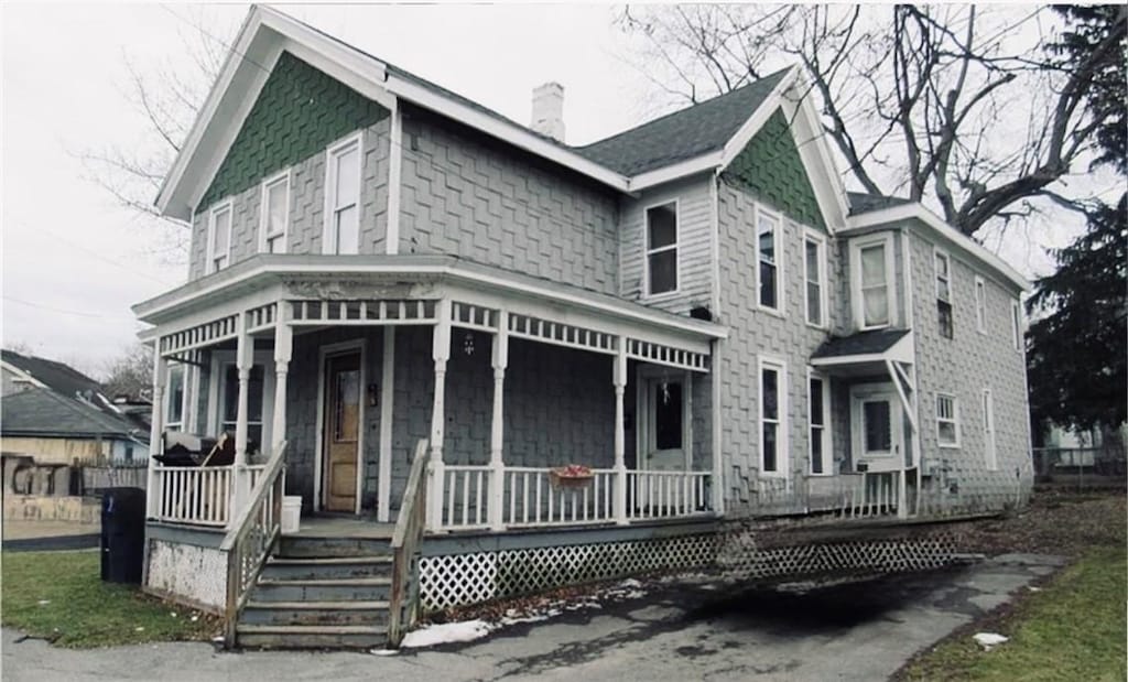 159 Canal St, Lyons, NY 14489 - victorian-style house with a porch and a chimney