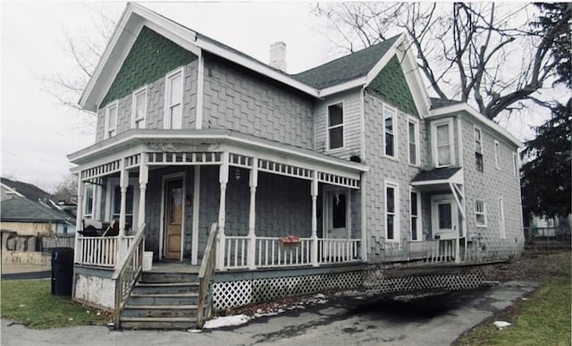159 Canal St, Lyons, NY 14489 - victorian-style house with a porch and a chimney
