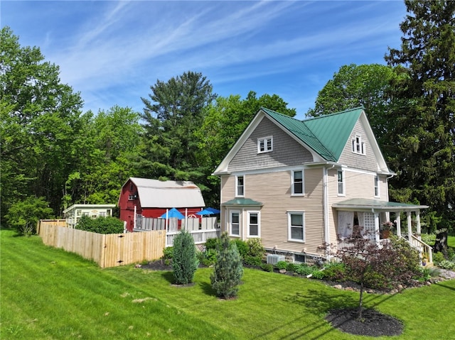 6207 Knickerbocker Rd, Ontario, NY 14519 - view of home's exterior featuring covered porch and an outdoor structure