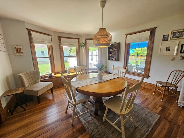 6207 Knickerbocker Rd, Ontario, NY 14519 - dining area featuring dark wood-style floors and baseboards