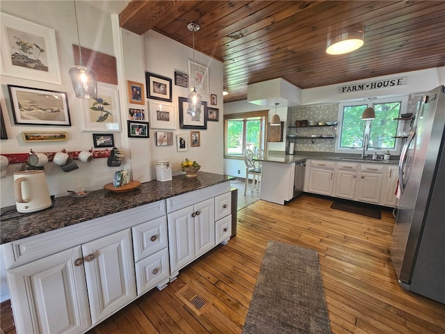 6207 Knickerbocker Rd, Ontario, NY 14519 - kitchen featuring stainless steel appliances, wood ceiling, white cabinetry, hardwood / wood-style floors, and hanging light fixtures