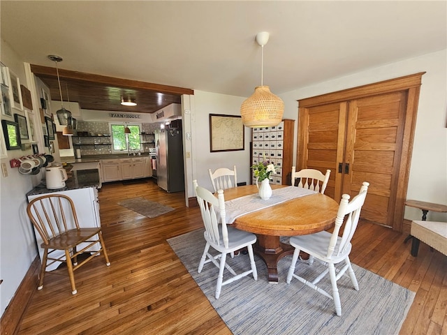 6207 Knickerbocker Rd, Ontario, NY 14519 - dining space featuring dark wood-style flooring and baseboards