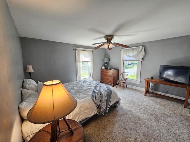 6207 Knickerbocker Rd, Ontario, NY 14519 - bedroom with multiple windows, carpet floors, baseboards, and ceiling fan