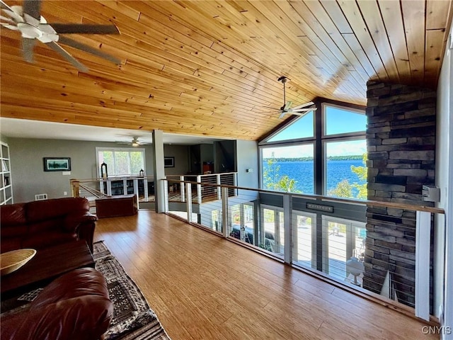 2 Perch Bay Rd, Morristown, NY 13669 - living room featuring a ceiling fan, wooden ceiling, wood finished floors, a water view, and high vaulted ceiling