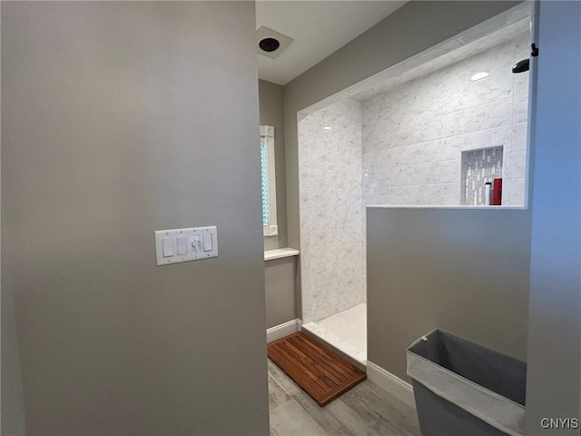 2 Perch Bay Rd, Morristown, NY 13669 - bathroom with walk in shower, wood finished floors, and baseboards