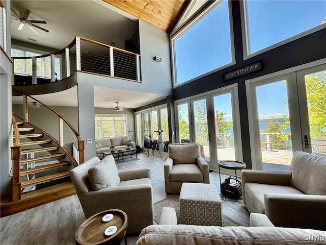 2 Perch Bay Rd, Morristown, NY 13669 - living room featuring french doors, ceiling fan, stairs, high vaulted ceiling, and wood ceiling