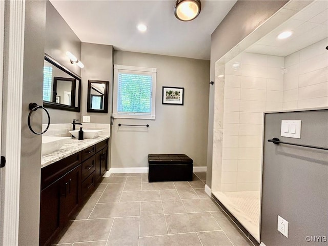 2 Perch Bay Rd, Morristown, NY 13669 - bathroom with double vanity, tiled shower, tile patterned floors, baseboards, and recessed lighting