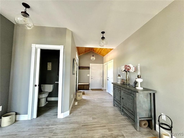 2 Perch Bay Rd, Morristown, NY 13669 - bathroom with toilet, vaulted ceiling, wood finished floors, and baseboards