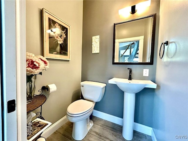2 Perch Bay Rd, Morristown, NY 13669 - half bath with toilet, wood finished floors, and baseboards