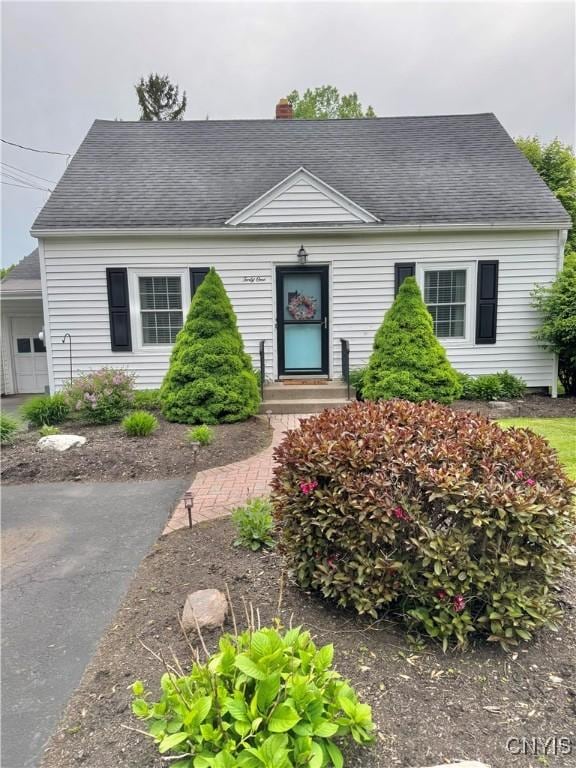 41 Letchworth St, Owasco, NY 13021 - view of front facade featuring a chimney and a shingled roof