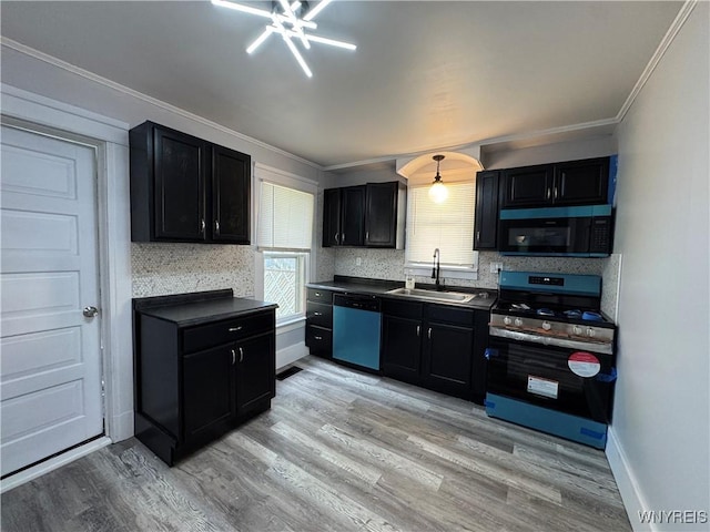 354 Schenck St, North Tonawanda, NY 14120 - kitchen featuring gas range, dishwashing machine, a sink, healthy amount of natural light, and crown molding