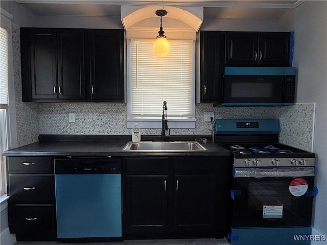 354 Schenck St, North Tonawanda, NY 14120 - kitchen featuring dishwasher, stainless steel range with gas stovetop, black microwave, a sink, and dark countertops
