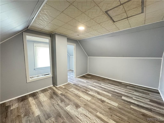 354 Schenck St, North Tonawanda, NY 14120 - additional living space with vaulted ceiling, wood finished floors, and baseboards