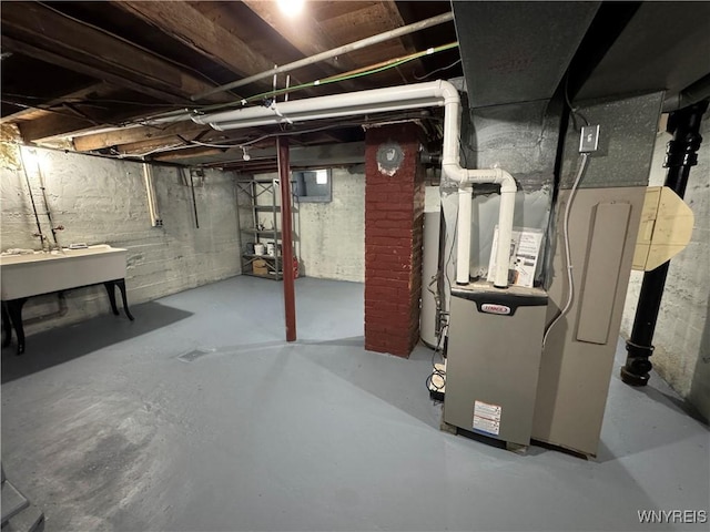 354 Schenck St, North Tonawanda, NY 14120 - unfinished below grade area with a sink and heating unit