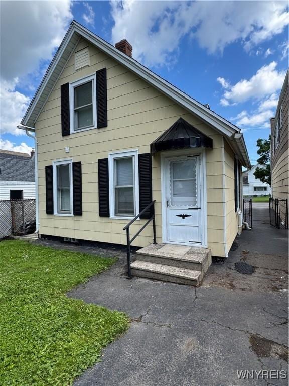 354 Schenck St, North Tonawanda, NY 14120 - view of front of property with a chimney