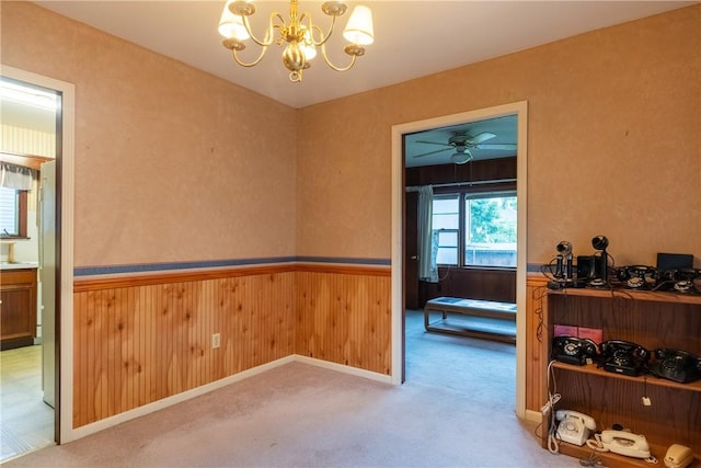 376 Imperial Ave, Erwin, NY 14870 - spare room with wainscoting, a chandelier, light carpet, and wooden walls