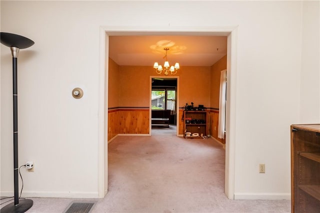 376 Imperial Ave, Erwin, NY 14870 - corridor with a chandelier, carpet floors, baseboards, and a wainscoted wall