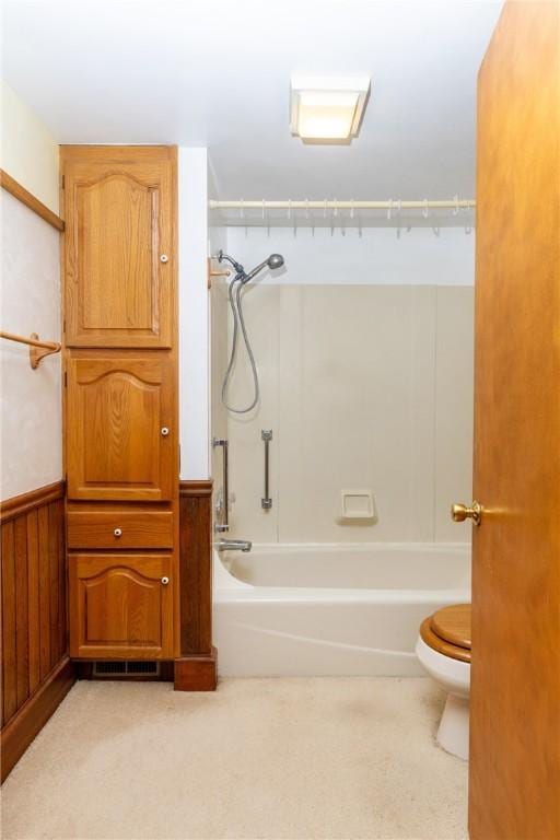 376 Imperial Ave, Erwin, NY 14870 - full bathroom with toilet, washtub / shower combination, and a wainscoted wall