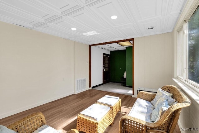 10652 Elm St, North Collins, NY 14111 - sitting room with light wood-style floors, an ornate ceiling, baseboards, a baseboard heating unit, and recessed lighting