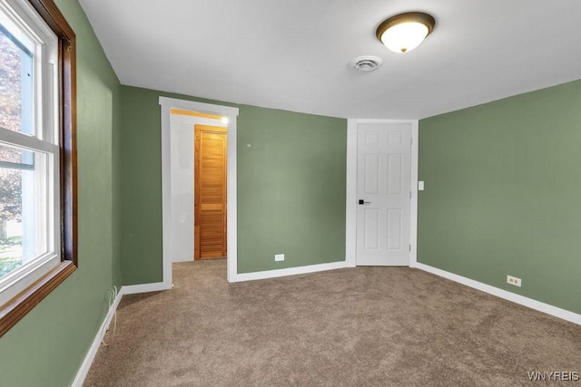 10652 Elm St, North Collins, NY 14111 - unfurnished bedroom featuring baseboards, carpet floors, and multiple windows
