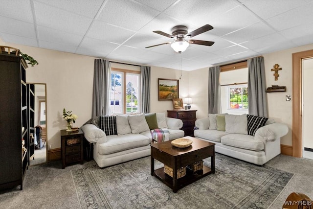 10652 Elm St, North Collins, NY 14111 - carpeted living room with a drop ceiling, healthy amount of natural light, and a ceiling fan