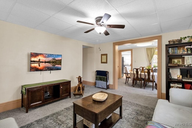 10652 Elm St, North Collins, NY 14111 - carpeted living area with a paneled ceiling, a ceiling fan, and baseboards