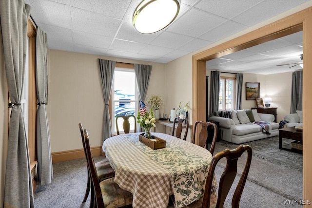 10652 Elm St, North Collins, NY 14111 - dining area featuring a paneled ceiling and carpet flooring
