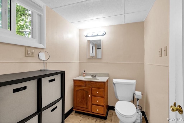 10652 Elm St, North Collins, NY 14111 - bathroom featuring vanity, toilet, tile patterned flooring, and a drop ceiling