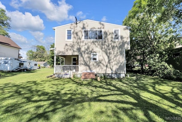 10652 Elm St, North Collins, NY 14111 - back of property with a lawn and covered porch