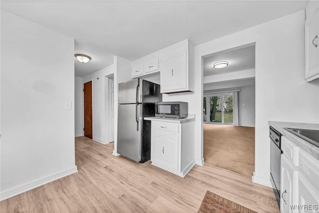 8 Robin Rd, Amherst, NY 14228 - kitchen featuring appliances with stainless steel finishes, white cabinetry, light wood finished floors, and baseboards