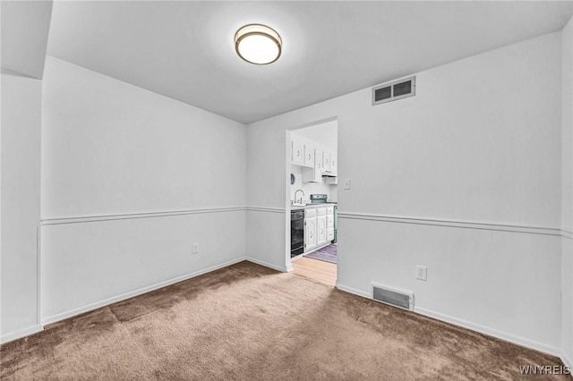 8 Robin Rd, Amherst, NY 14228 - carpeted empty room with baseboards, beverage cooler, and a sink