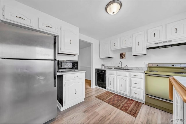 8 Robin Rd, Amherst, NY 14228 - kitchen featuring appliances with stainless steel finishes, under cabinet range hood, a sink, and white cabinets