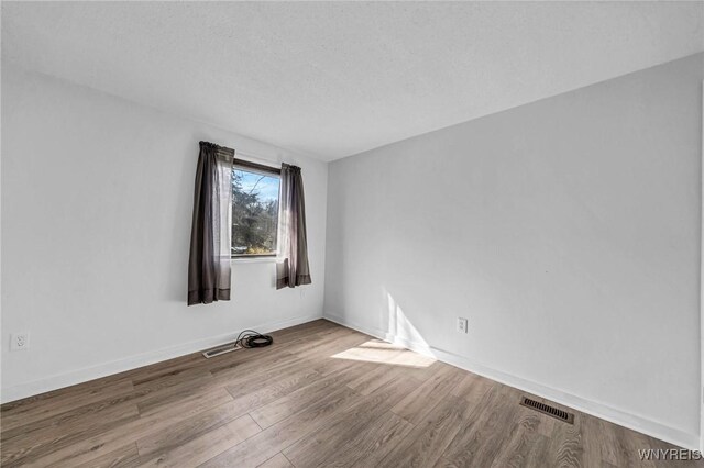 8 Robin Rd, Amherst, NY 14228 - empty room with wood finished floors and baseboards