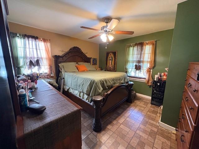 106 Rexford St, Rochester, NY 14621 - bedroom with baseboards, brick patterned floors, and ceiling fan