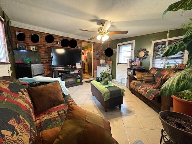 106 Rexford St, Rochester, NY 14621 - tiled living area featuring brick wall and ceiling fan