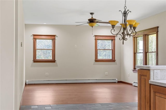 2779 Maricle Rd, Freetown, NY 13040 - unfurnished dining area featuring ceiling fan, hardwood / wood-style flooring, a chandelier, a baseboard radiator, and baseboard heating