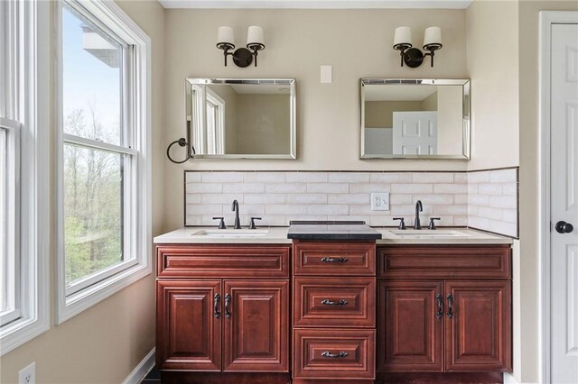 2779 Maricle Rd, Freetown, NY 13040 - bathroom featuring double vanity, backsplash, and baseboards