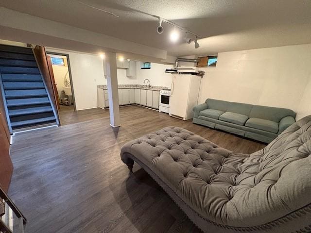 245 Weaver St, Rochester, NY 14621 - living room with stairs, dark wood-type flooring, and rail lighting