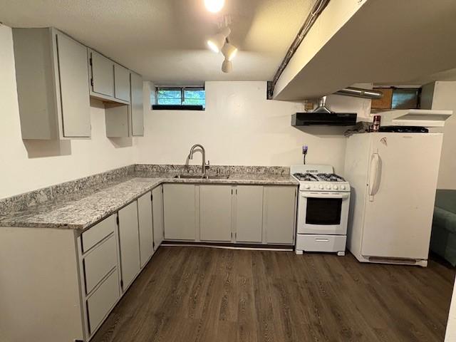 245 Weaver St, Rochester, NY 14621 - kitchen with white appliances, dark wood finished floors, a sink, and under cabinet range hood