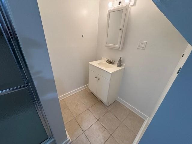 245 Weaver St, Rochester, NY 14621 - bathroom with vanity, tile patterned floors, and baseboards