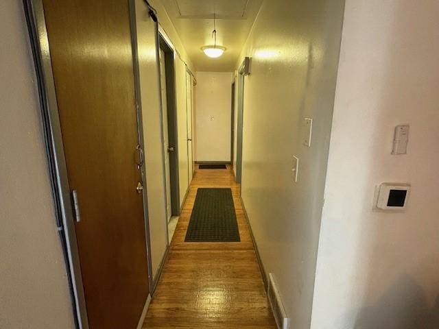 245 Weaver St, Rochester, NY 14621 - hallway featuring attic access, light wood-style flooring, and baseboards