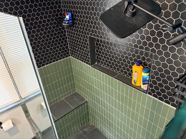 245 Weaver St, Rochester, NY 14621 - full bathroom featuring a tile shower and tile patterned floors