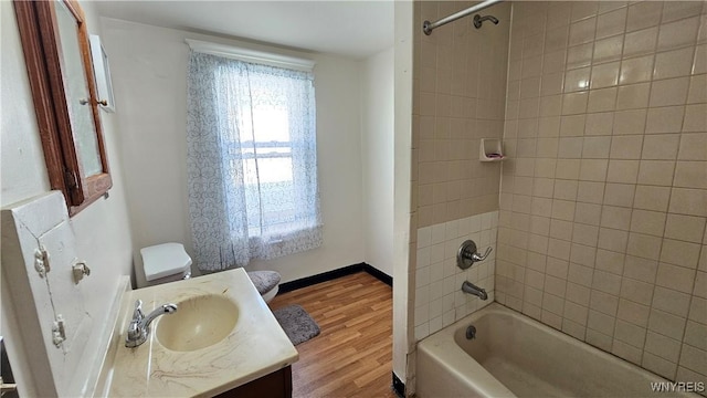 341 Dartmouth Ave, Buffalo, NY 14215 - bathroom featuring vanity, tub / shower combination, wood finished floors, and toilet